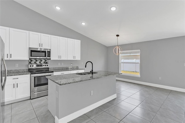 kitchen with a kitchen island with sink, hanging light fixtures, sink, light stone countertops, and appliances with stainless steel finishes