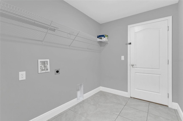 laundry room with hookup for an electric dryer, hookup for a washing machine, and light tile patterned flooring