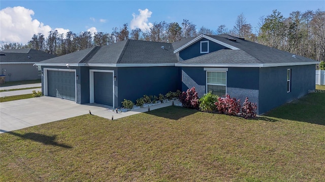 ranch-style house featuring a front lawn and a garage