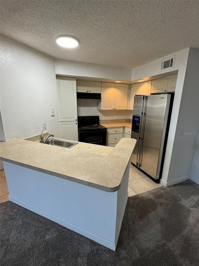 kitchen featuring kitchen peninsula, stainless steel fridge, sink, and black electric range oven