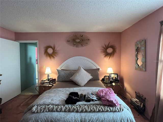 carpeted bedroom with a textured ceiling