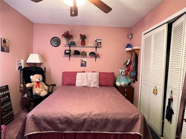 bedroom featuring carpet, a textured ceiling, a closet, and ceiling fan