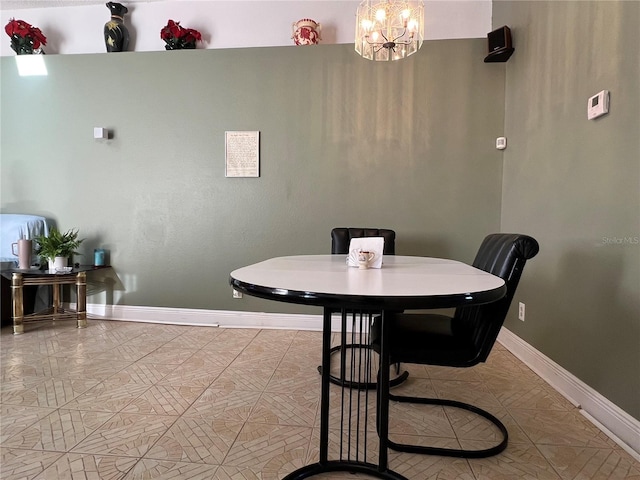 dining room with a notable chandelier