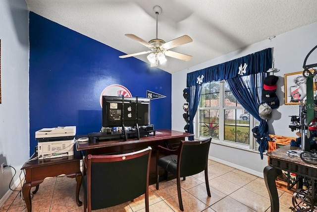 office area featuring tile patterned flooring, ceiling fan, and a textured ceiling