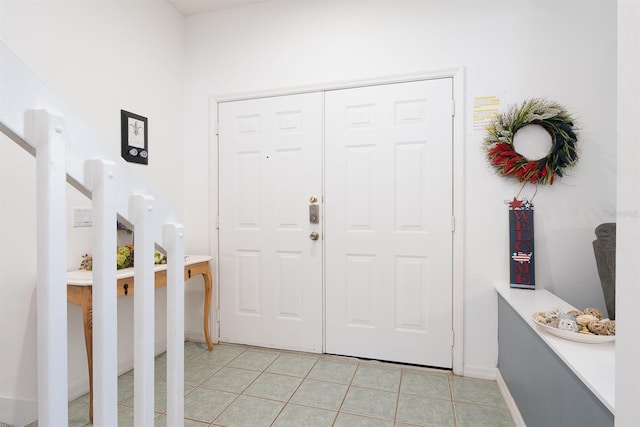 entrance foyer featuring light tile patterned flooring