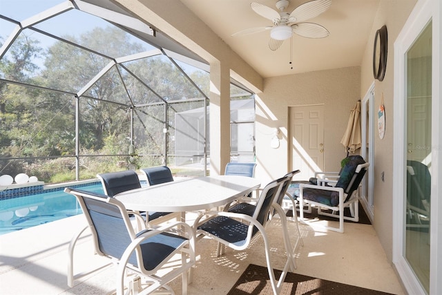 view of patio / terrace featuring ceiling fan and a lanai