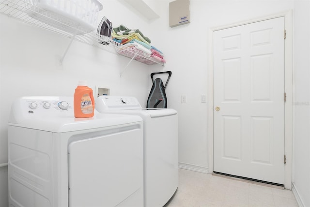 clothes washing area featuring separate washer and dryer