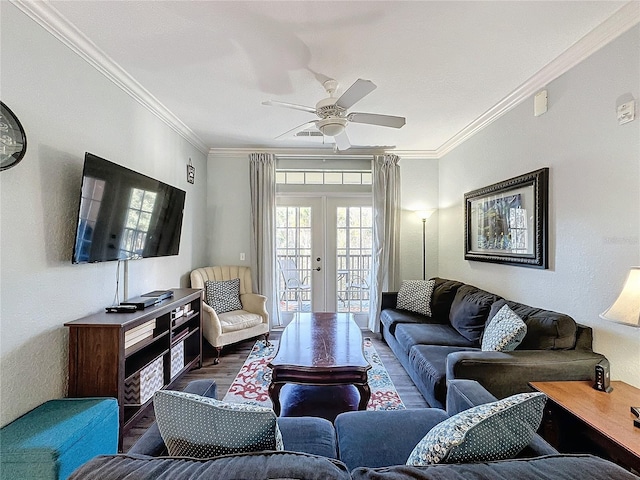 living room with french doors, dark wood-type flooring, ceiling fan, and crown molding