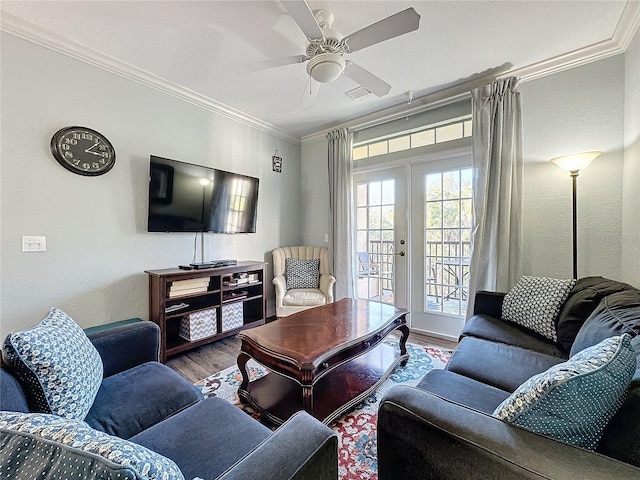 living room featuring french doors, hardwood / wood-style flooring, ceiling fan, and ornamental molding