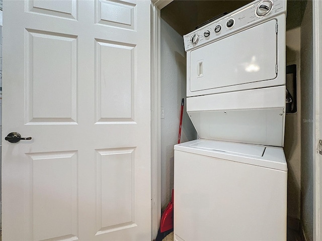 laundry area featuring stacked washer and dryer