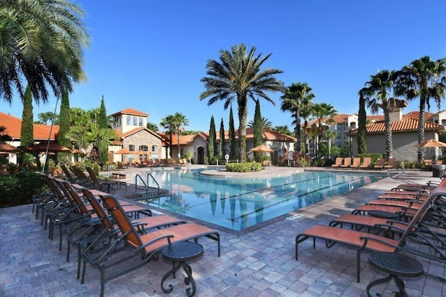 view of swimming pool featuring a patio area