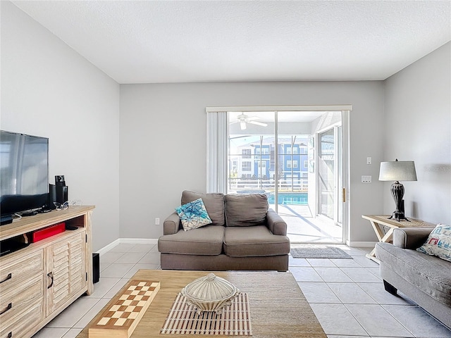 living room with light tile patterned floors and a textured ceiling