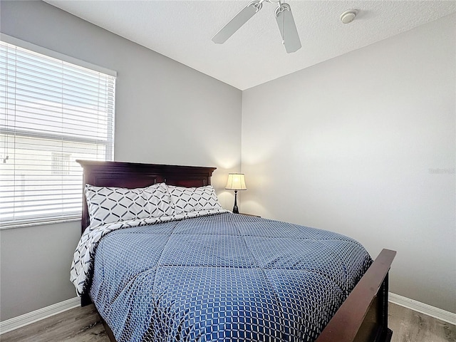 bedroom featuring ceiling fan and hardwood / wood-style floors