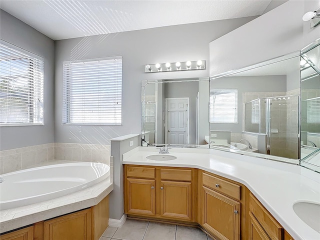 bathroom featuring separate shower and tub, tile patterned flooring, and vanity