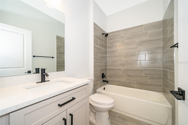 bathroom featuring toilet, vanity, and washtub / shower combination