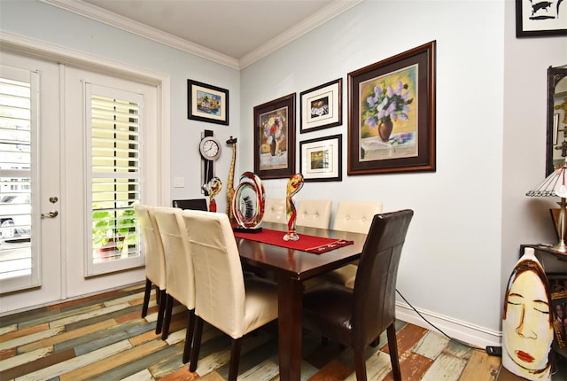 dining room featuring wood-type flooring, crown molding, and french doors