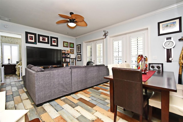 living room with ceiling fan, light hardwood / wood-style floors, ornamental molding, and french doors