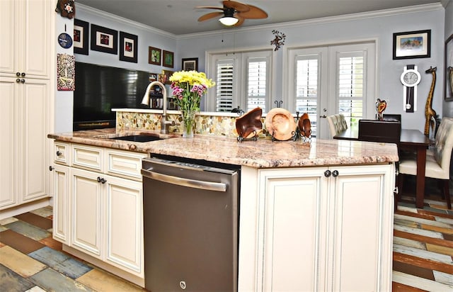 kitchen with stainless steel dishwasher, light stone counters, an island with sink, and french doors