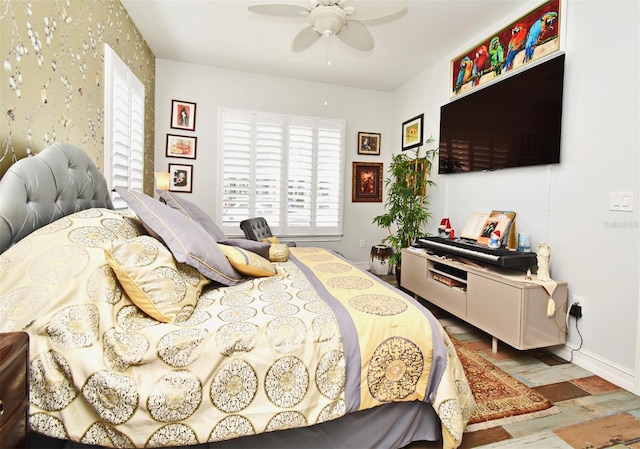 bedroom with hardwood / wood-style flooring and ceiling fan