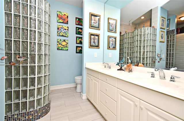 bathroom with curtained shower, vanity, and toilet