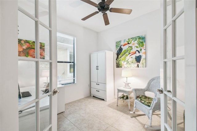 living area featuring ceiling fan, french doors, and light tile patterned floors