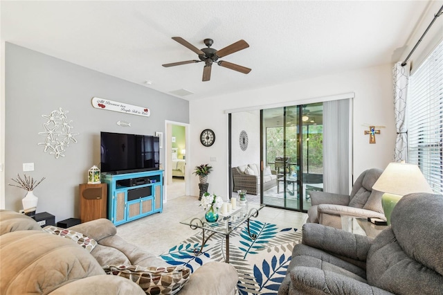 tiled living room featuring ceiling fan