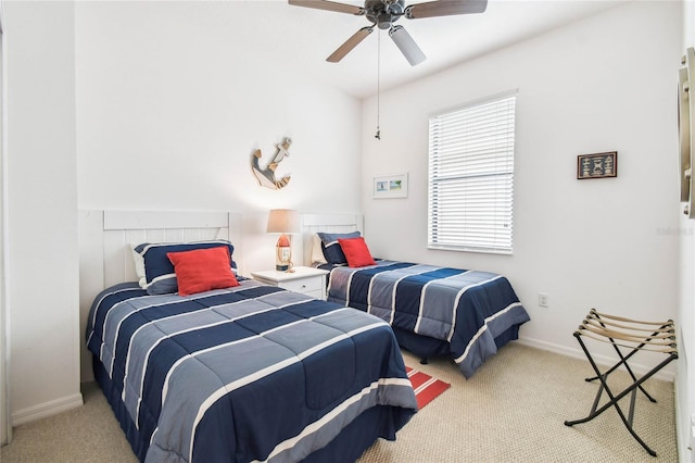 bedroom with light carpet and ceiling fan