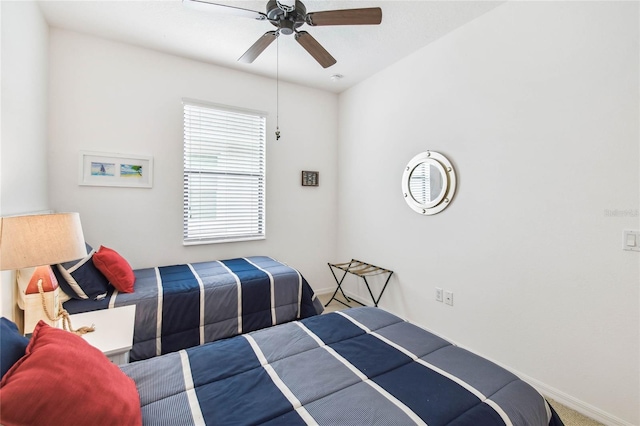 bedroom with ceiling fan and carpet