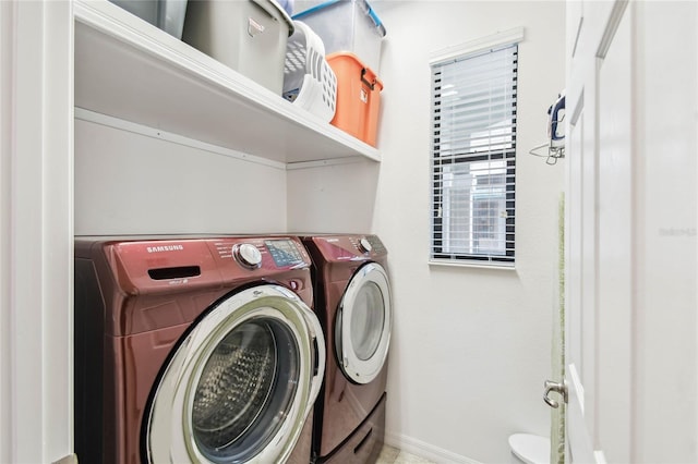 laundry room with washing machine and dryer