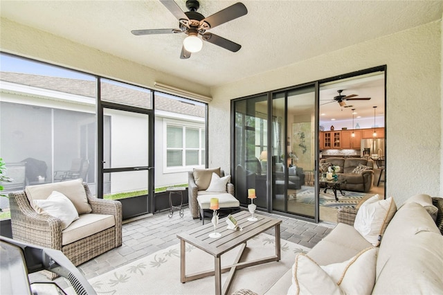 sunroom with ceiling fan