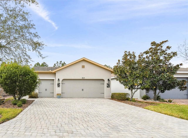 ranch-style house featuring a garage