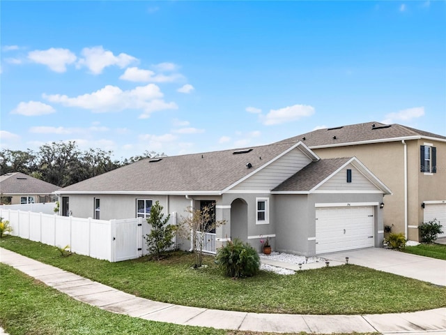 ranch-style home with a front yard and a garage