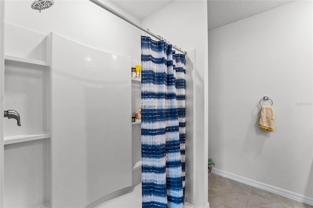 bathroom featuring tile patterned flooring and curtained shower