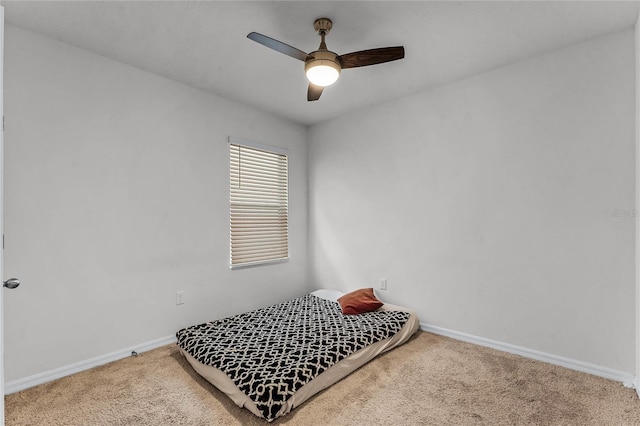 bedroom with ceiling fan and carpet floors