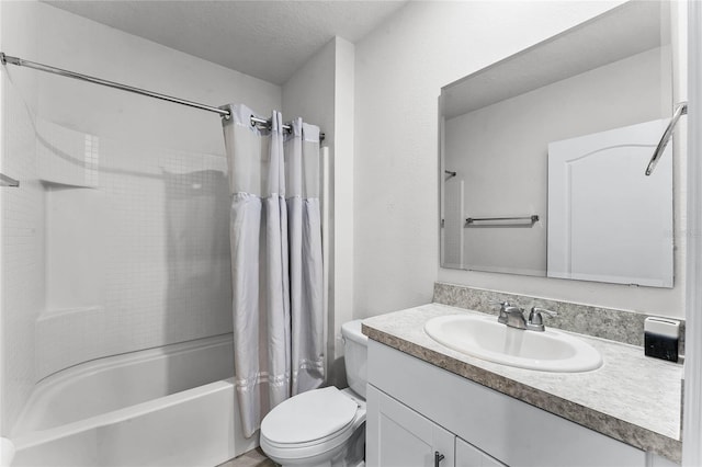 full bathroom with vanity, shower / bath combination with curtain, a textured ceiling, and toilet