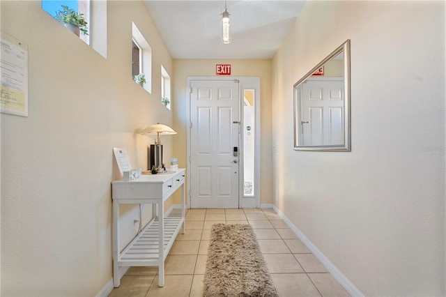 doorway to outside featuring light tile patterned floors