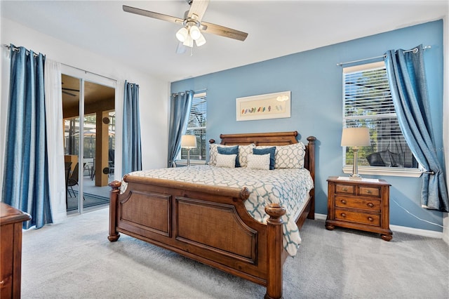 bedroom with access to outside, light colored carpet, and ceiling fan