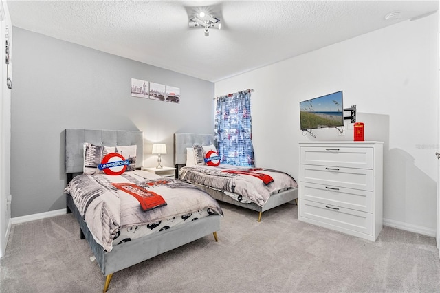 carpeted bedroom with a textured ceiling