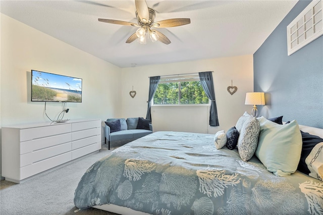 bedroom featuring light colored carpet and ceiling fan