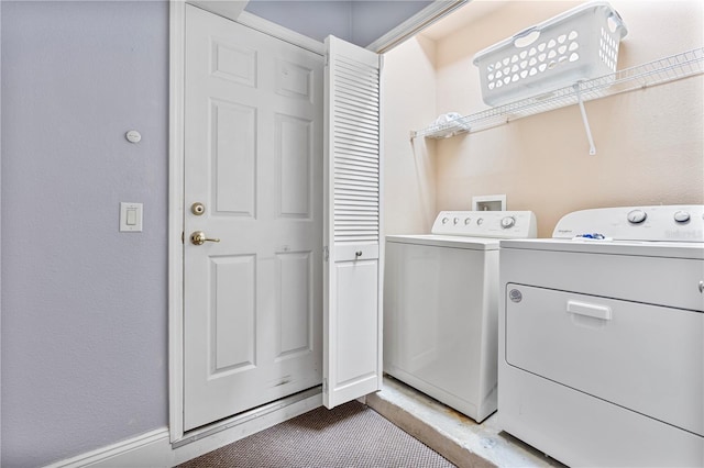 laundry room featuring washing machine and clothes dryer