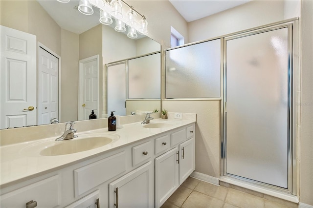 bathroom featuring vanity, tile patterned floors, and an enclosed shower