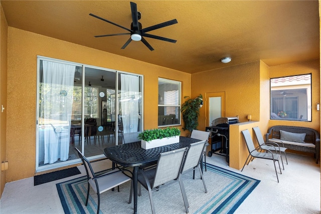 view of patio featuring ceiling fan