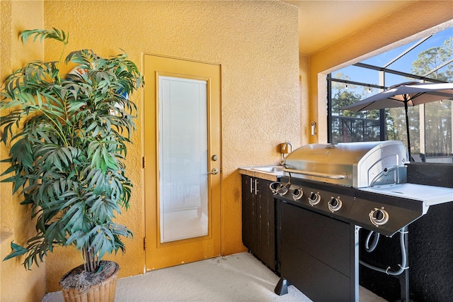 view of patio / terrace with area for grilling and sink