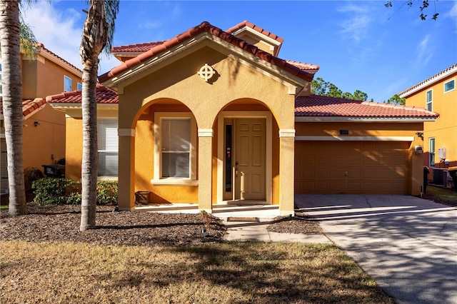 mediterranean / spanish house featuring a garage