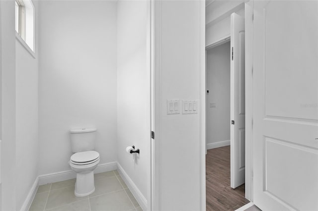 bathroom featuring tile patterned flooring and toilet