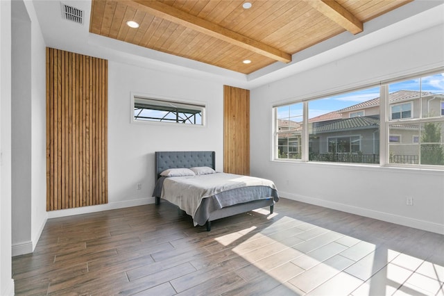 bedroom with beamed ceiling and wood ceiling