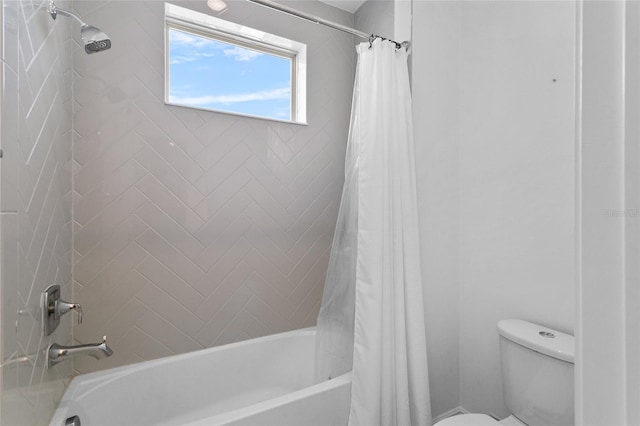 bathroom featuring toilet and shower / tub combo with curtain