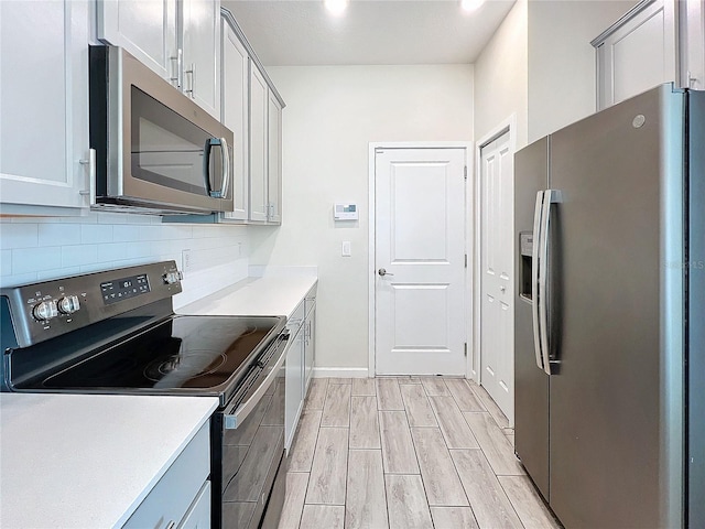 kitchen featuring tasteful backsplash and stainless steel appliances