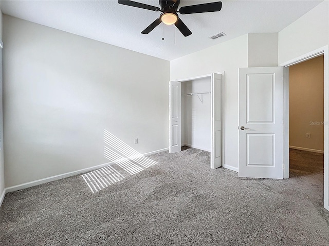 unfurnished bedroom featuring carpet flooring, a textured ceiling, ceiling fan, and a closet