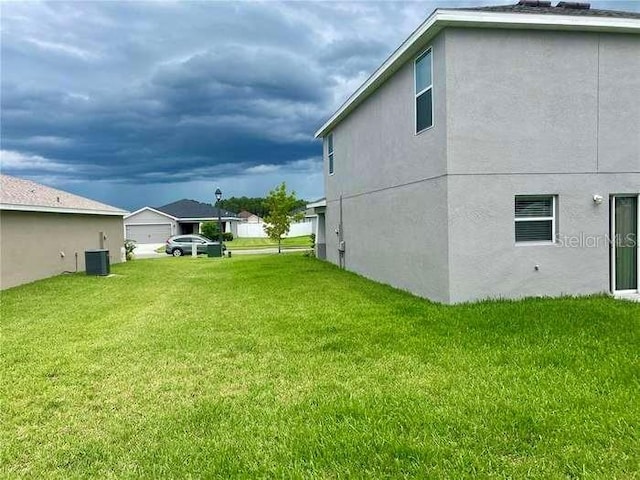 view of yard featuring central AC